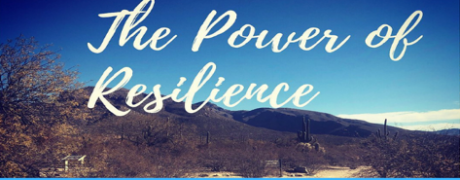 Text overlay on a serene desert landscape, reading "The Power of Resilience," against a backdrop of mountains and clear blue sky.