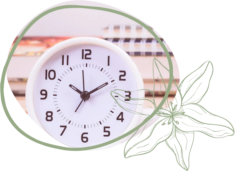 A white wall clock shows a time of 10:10, surrounded by a green circular outline and leaf illustrations, with blurred books in the background.