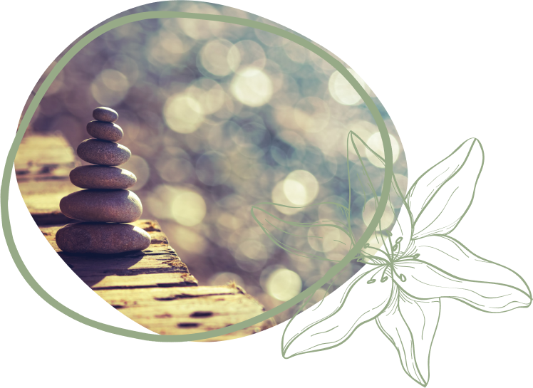 A tranquil stack of stones on a wooden surface with a soft, blurred background, surrounded by a delicate floral outline.