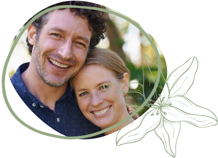 A close-up of two people in a natural setting, surrounded by greenery, framed by an artistic outline and floral design.