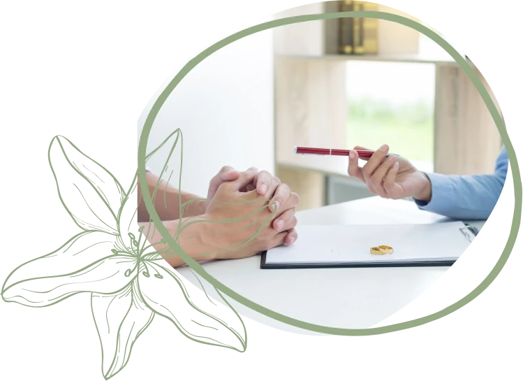 A therapist engages with a couple on a couch, discussing their relationship in a modern, well-lit living room setting.